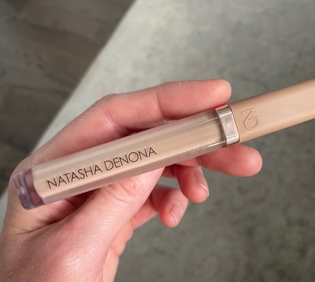 concealer tube iin hand